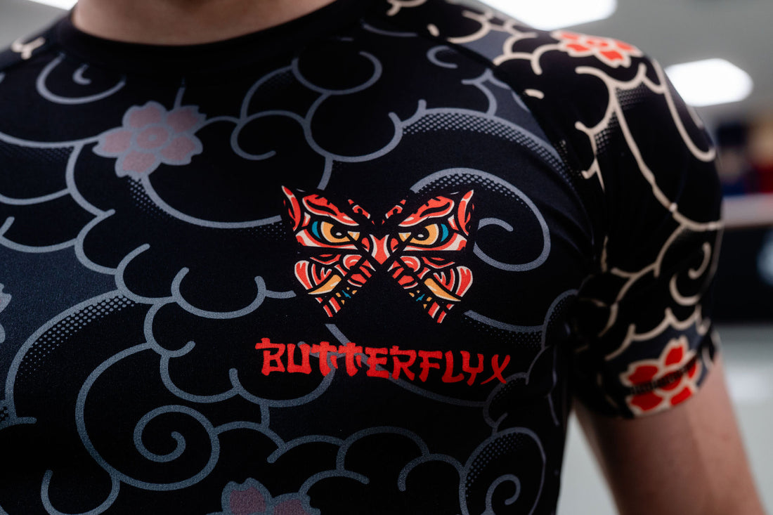 Black athletic shirt with butterfly design and 'ButterflyX' branding